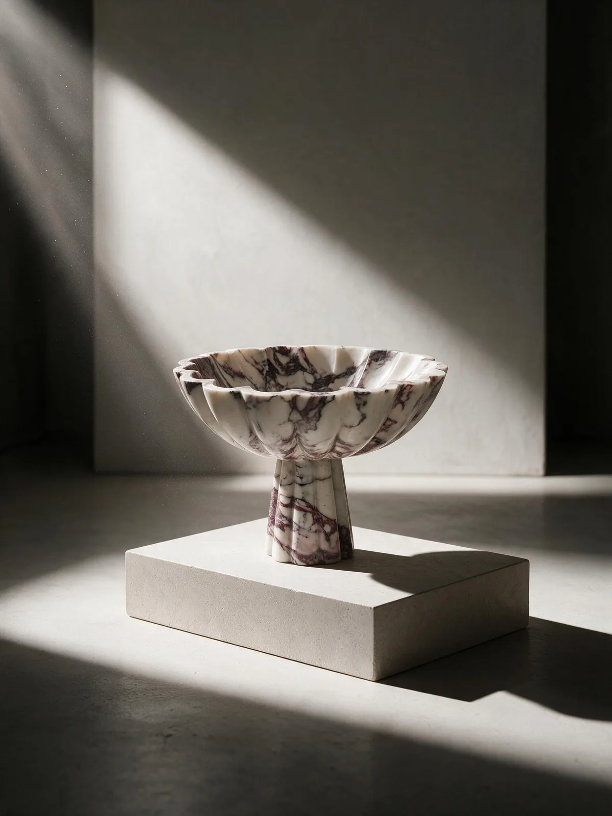 Calacatta Viola marble pedestal bowl, scalloped and hollowed by hand.
